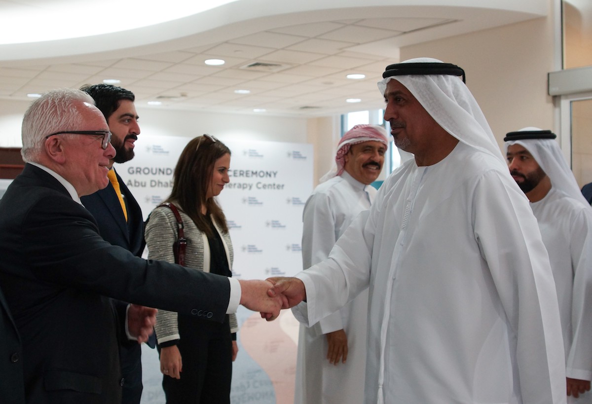 Jack Irvine shakes the hand of Sheikh Dr Sultan Bin Khalifa Bin Zayed Al Nahyan in Abu Dhabi