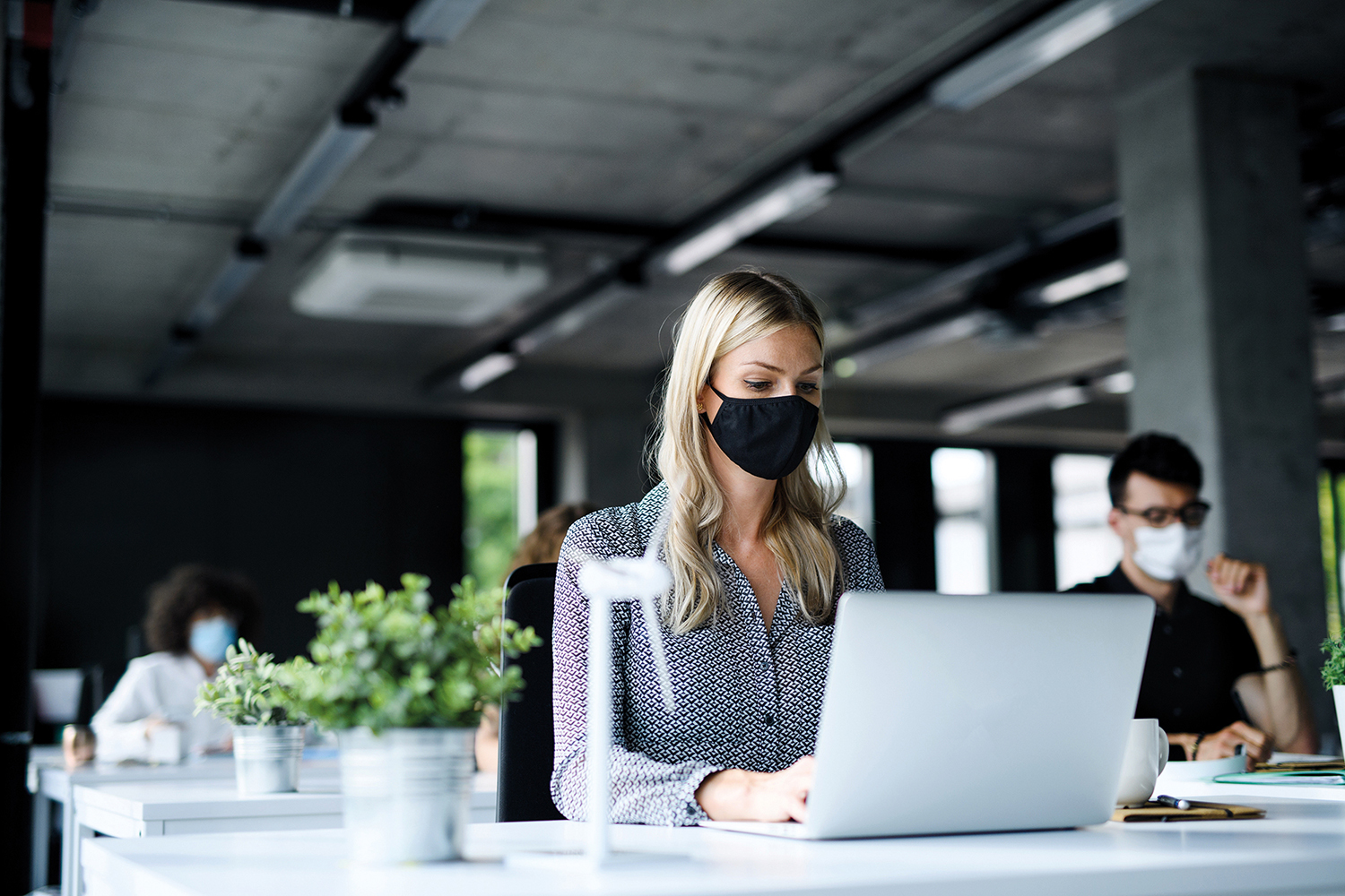 Office worker wearing face covering COVID – corporate PR